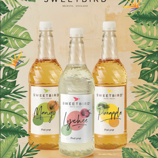 Three bottles of Sweetbird tropical fruit syrups on a leafy background